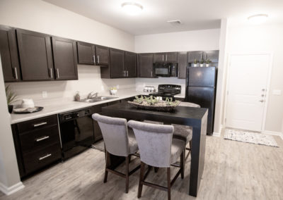 Kitchen area at The Villages at Fiskville retirement community with center island seating